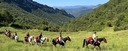 A group of riders on a trail ride in the Spanish Pyrenees