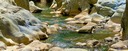 A river sparkling in the sunlight in the Alta Garrotxa mountains