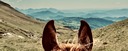 View from horseback across a vast mountain landscape during a trail riding adventure in the Pyrenees